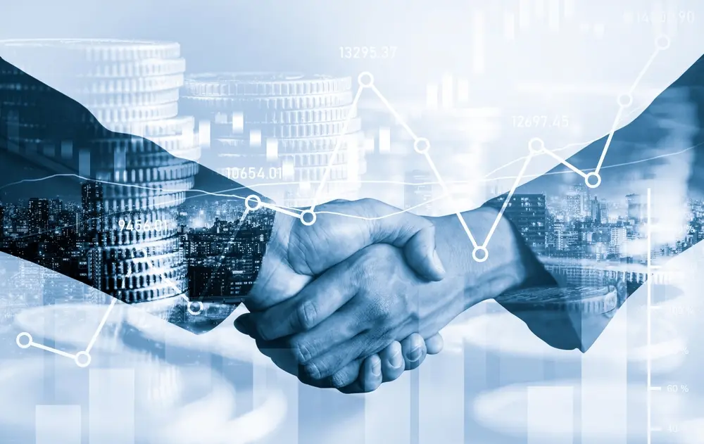 Business handshake with double-exposure cityscape and revenue growth charts representing trust-driven partnerships and data-driven success